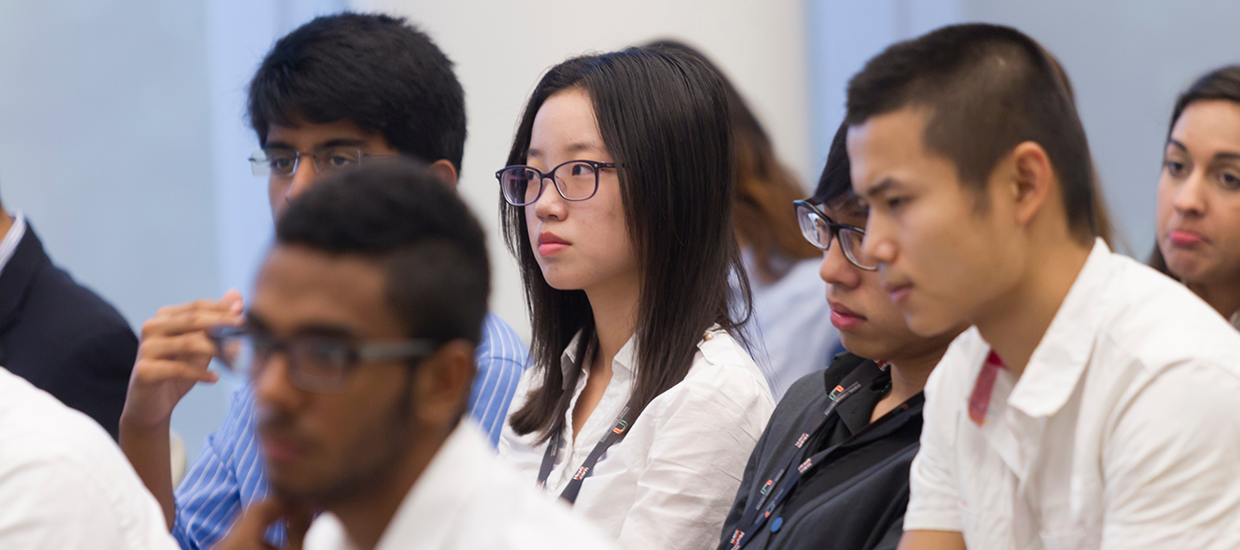 Students listening at a workshop