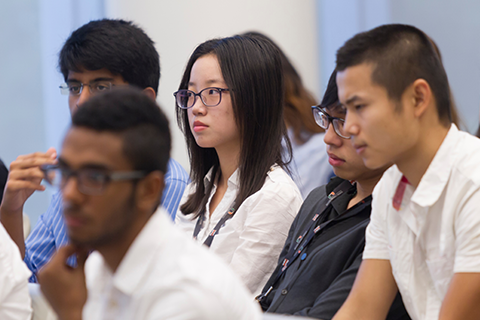 Students listening at a workshop